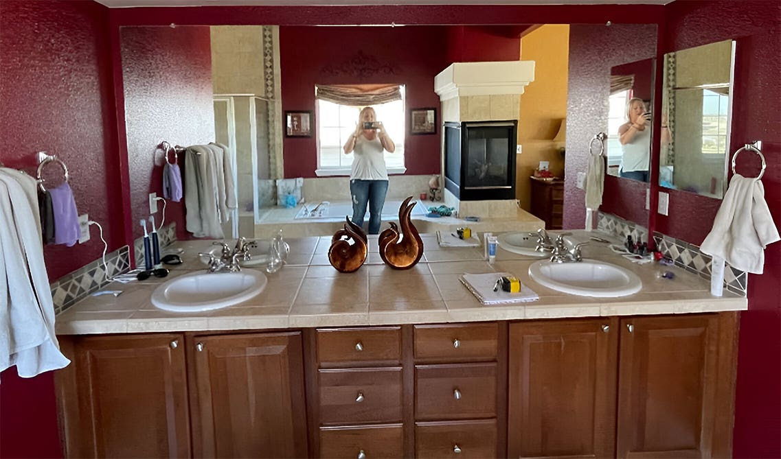Brown bathroom vanity with tile countertop