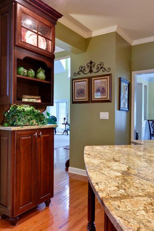 Kitchen design with Olive Green Walls and Brown Cabinets