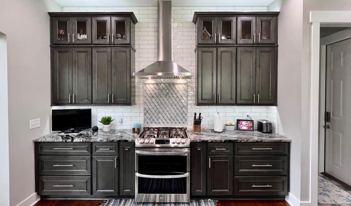 One wall kitchen with dark gray cabinets