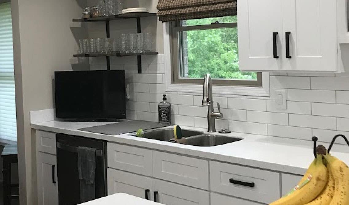 Kitchen design with Open shelving, white cabinets, and farmhouse sink 