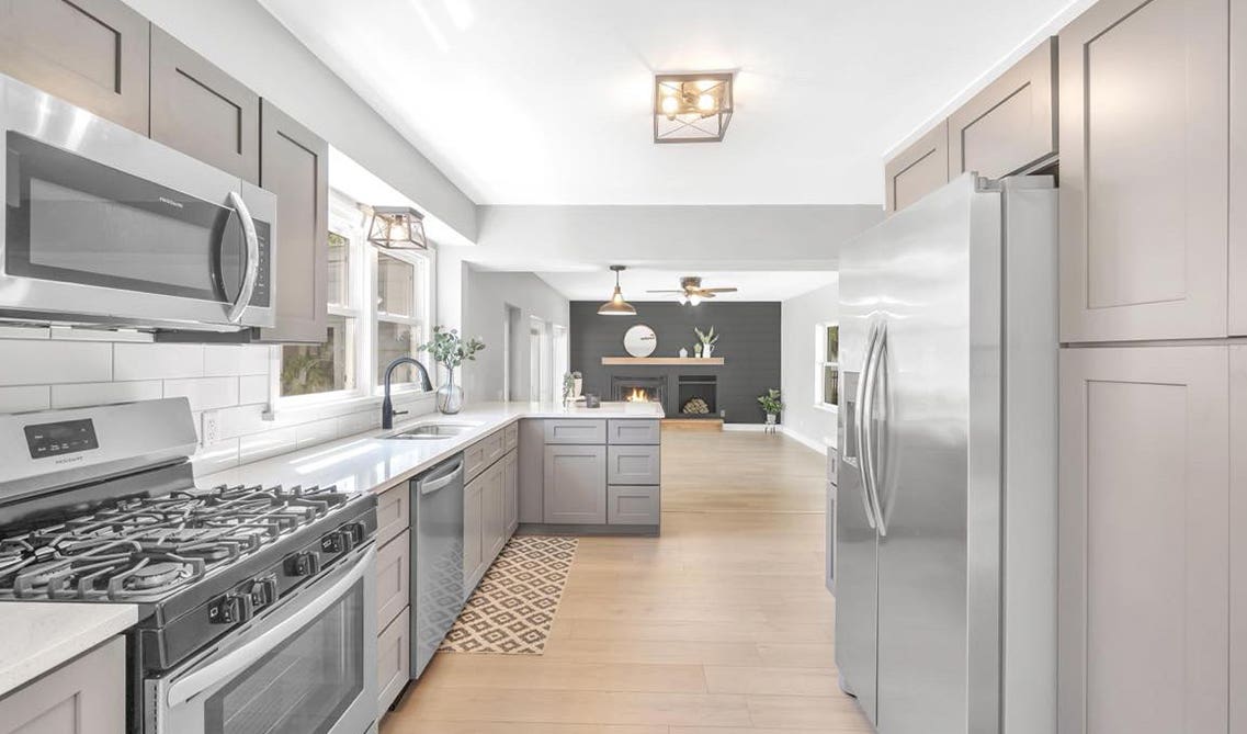 Parallel kitchen design with gray cabinets