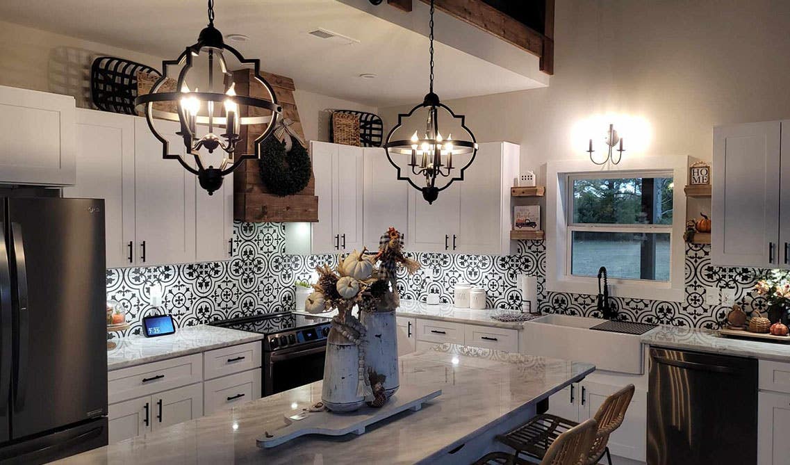 Kitchen design with white cabinets and decorative backsplash