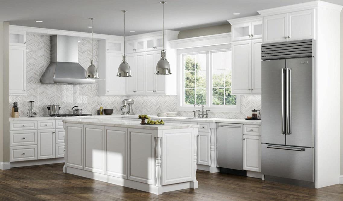 Kitchen with bright white cabinets, small island and Pendant Kitchen Lighting