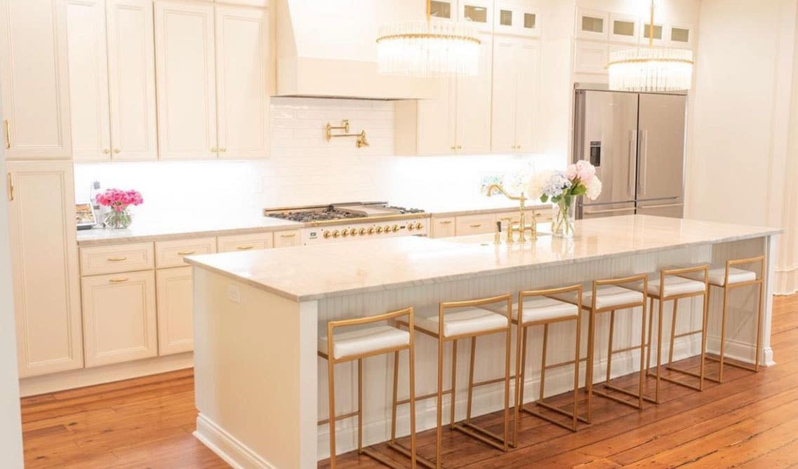 Personalized Kitchen Design with white cabinets, Gold accent and luxury pendent lights