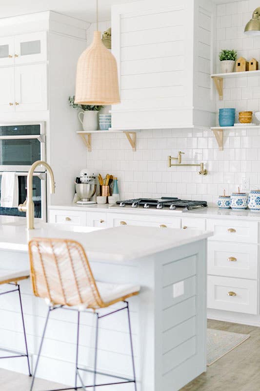 stunning country kitchen design with white cabinet with gold hardware, small island with sink, 