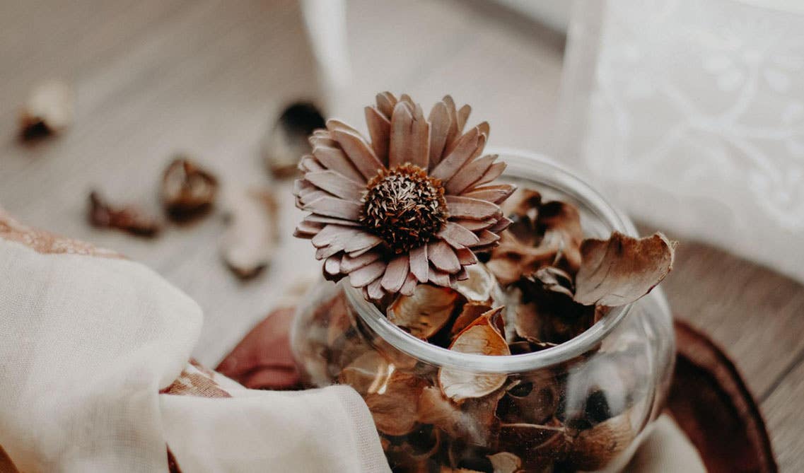  Potpourri bowls filled with dried cinnamon sticks, cloves, and petals