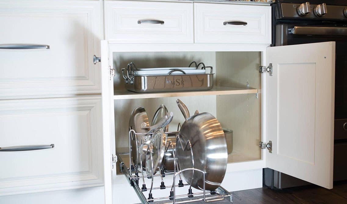 Pull out cabinet organizer with stainless steel utensils 
