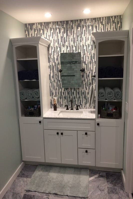 Bathroom vanity area with recessed light 