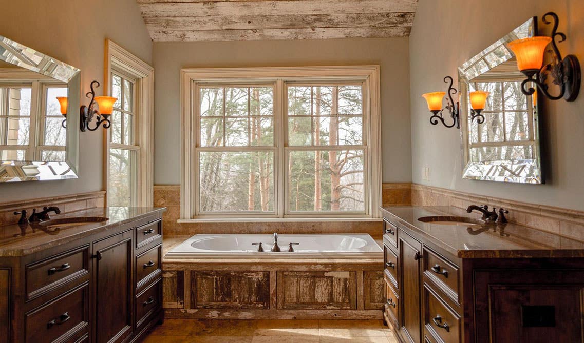 Rustic Bathroom design with Jacuzzi, wooden vanities, mirror and large square window