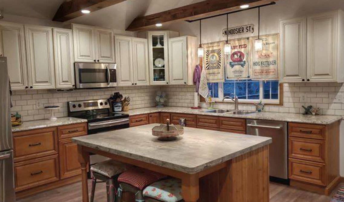 Spacious kitchen with distressed wooden beams