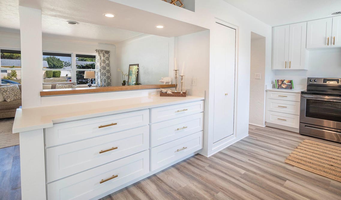 Stylish white kitchen design with spc flooring