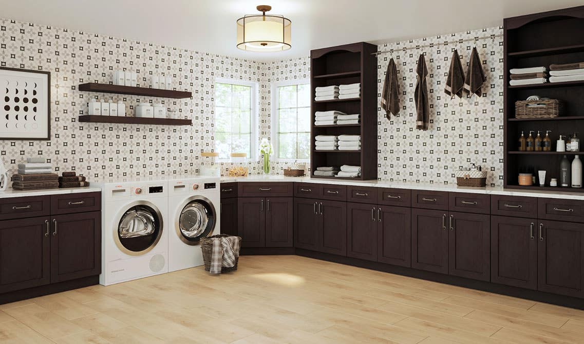  Laundry Room with dark cabinets, washer and dryer, open shelves, marble countertop and vinyl flooring