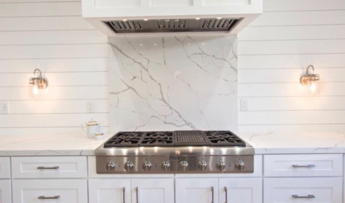 Modern kitchen with Shiplap backsplash and white cabinets