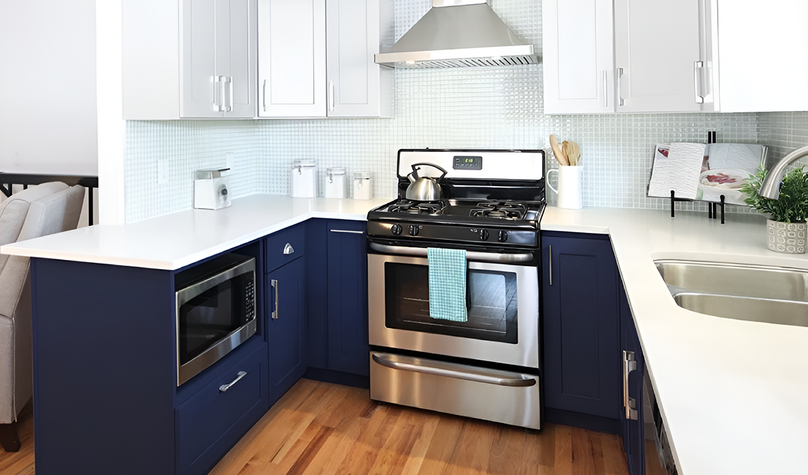 Dual tone kitchen cabinets paired with silver hardware
