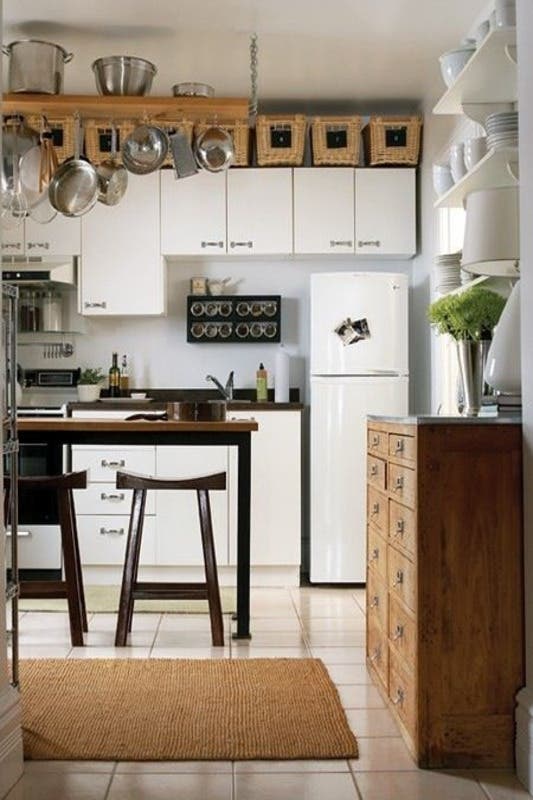 Small kitchen with full wall cabinets