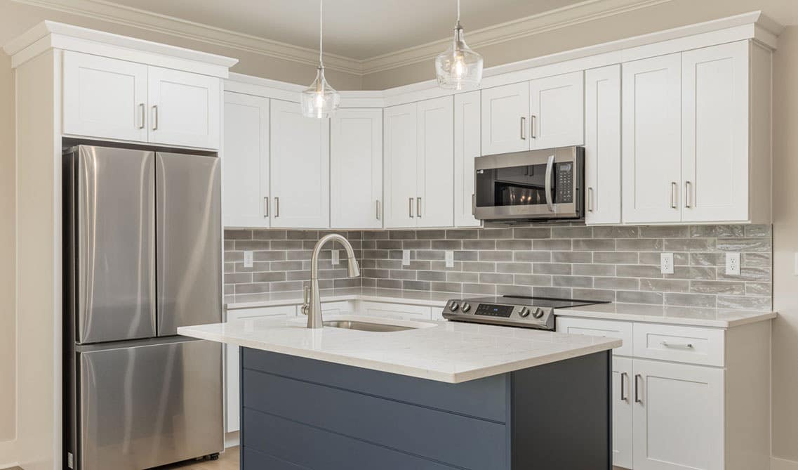 Smart kitchen design with white and navy blue cabinets