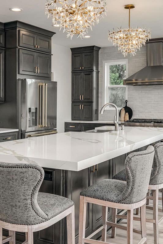 Gray driftwood kitchen cabinets paired with stainless steel appliances 