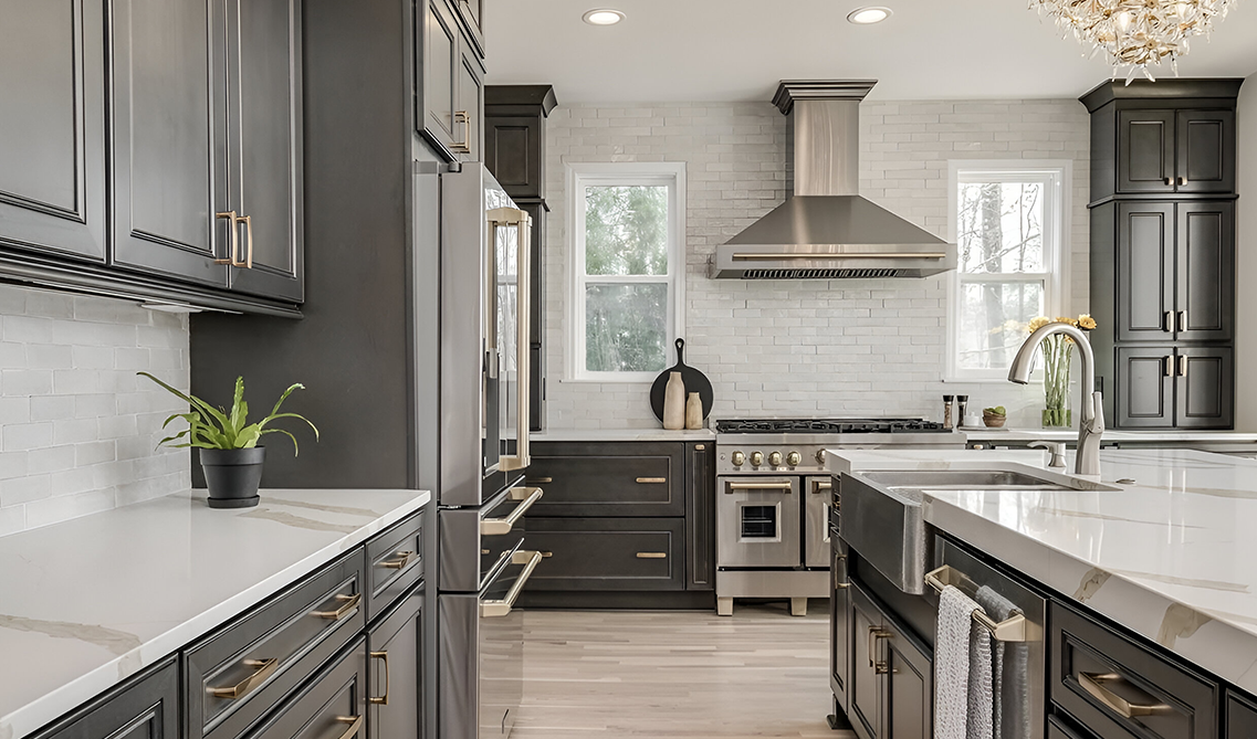 Stainless steel range hood paired with gray driftwood cabinets