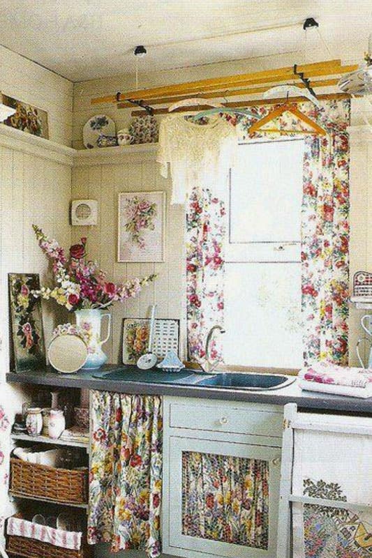 Cottage space with floral curtains, and a mix of vintage and modern furnishings