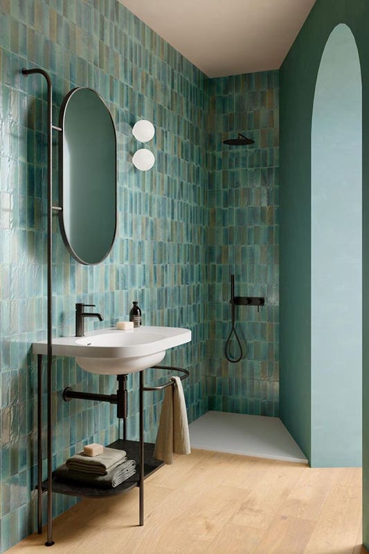 Teal Green bathroom paired with free standing sink and black matt fixture 
