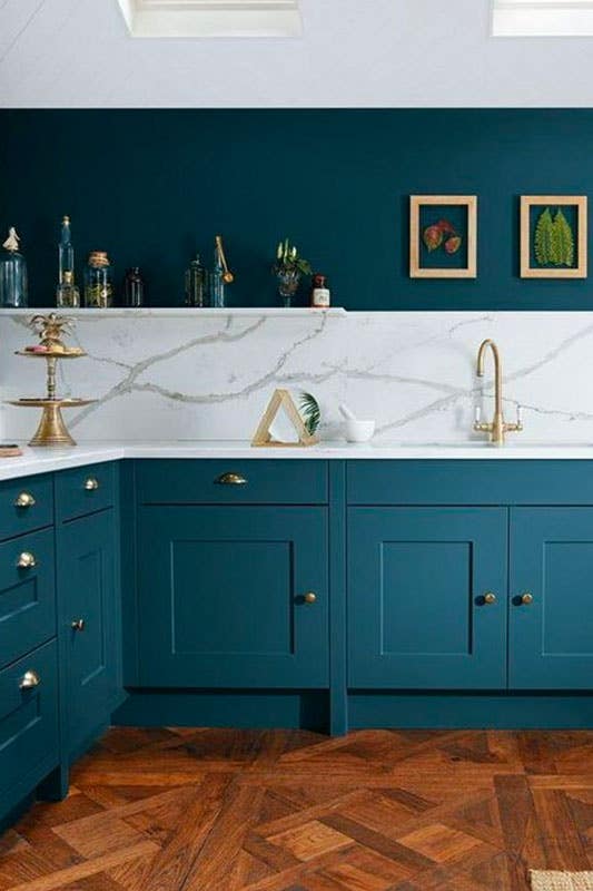 Teal kitchen cabinets with gold hardware