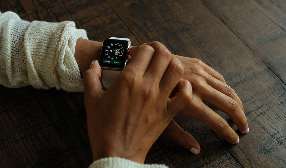 Person watching time on wrist watch 