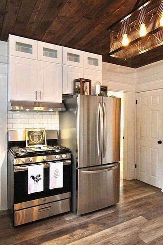 French Country kitchen with white cabinetry