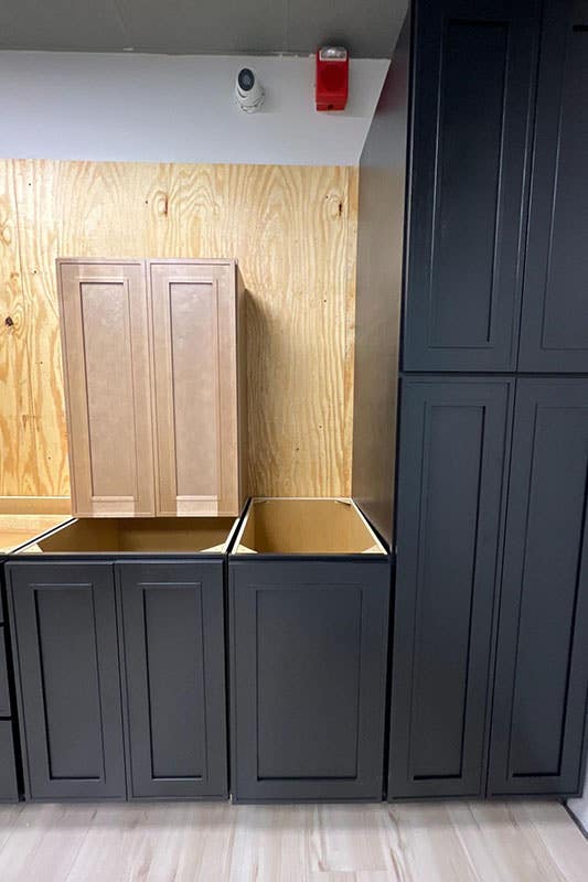 Kitchen design with Two Toned Black and Natural Cabinets