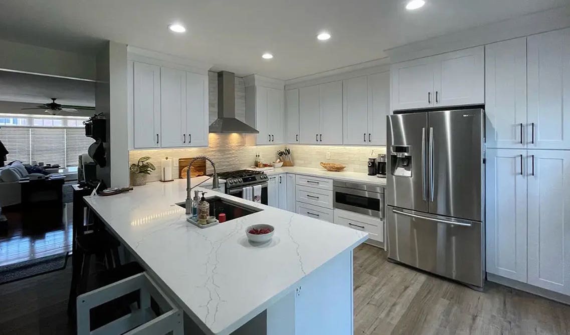 U-Shaped Kitchen Layout feature white shaker cabinets and stainless steel appliances 