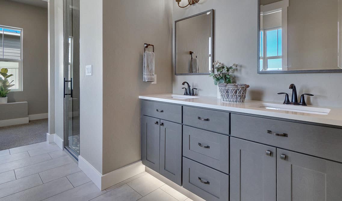 beautiful gray vanity with under cabinet light