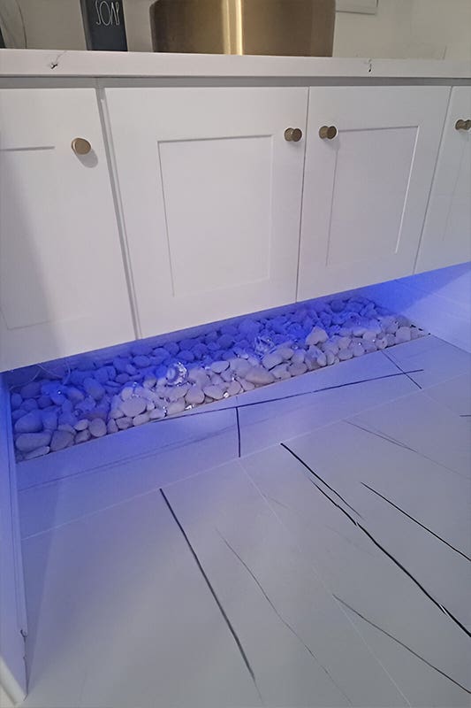 bathroom vanity with under-cabinet lighting