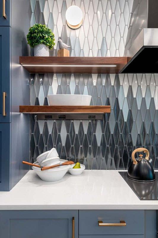 Modern kitchen with Unique Tile Backsplash and navy blue cabinets