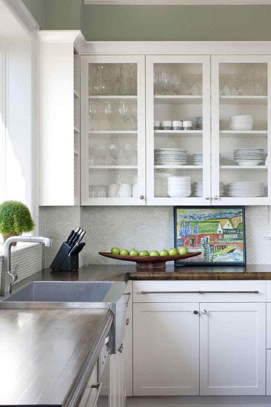 kitchen design white cabinets with glass door, wooden countertop, silver hardware and knife holder