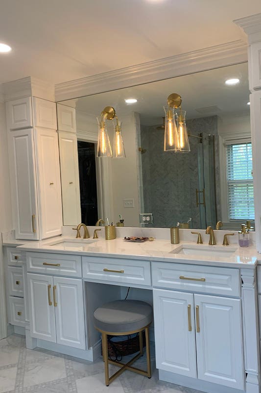 custom-built vanity with gold fixture