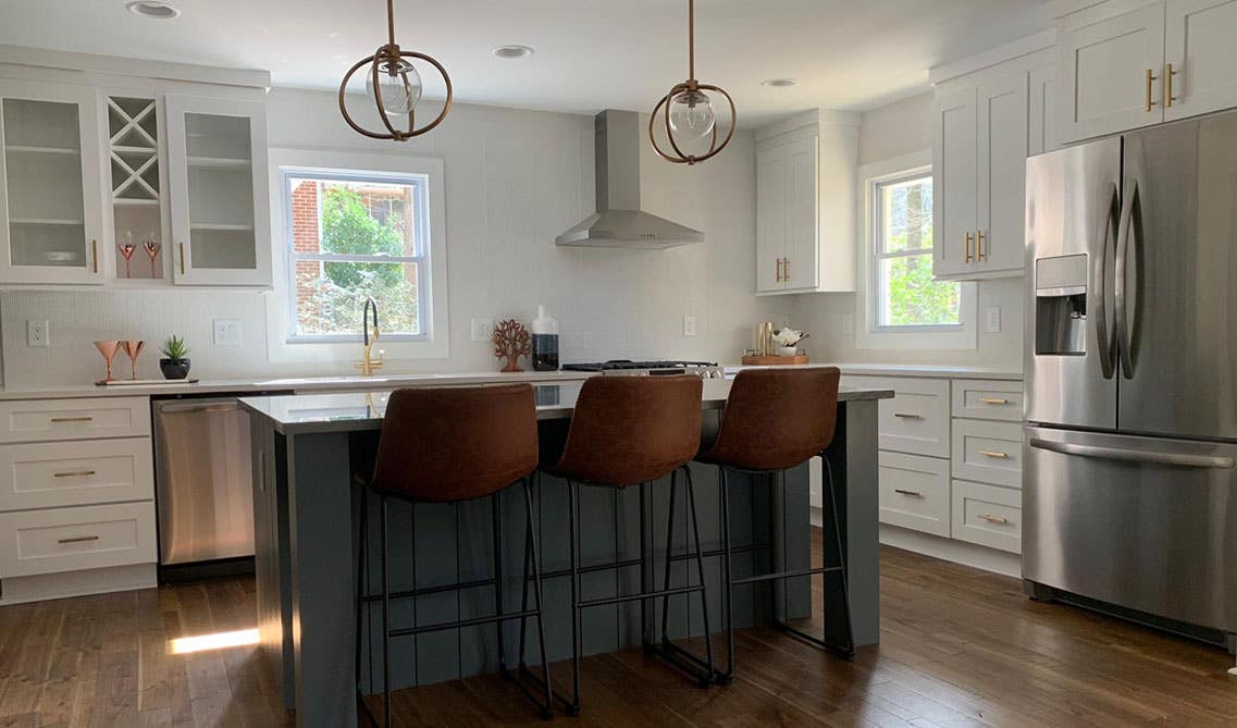 French country kitchen with vintage-inspired brass fixtures