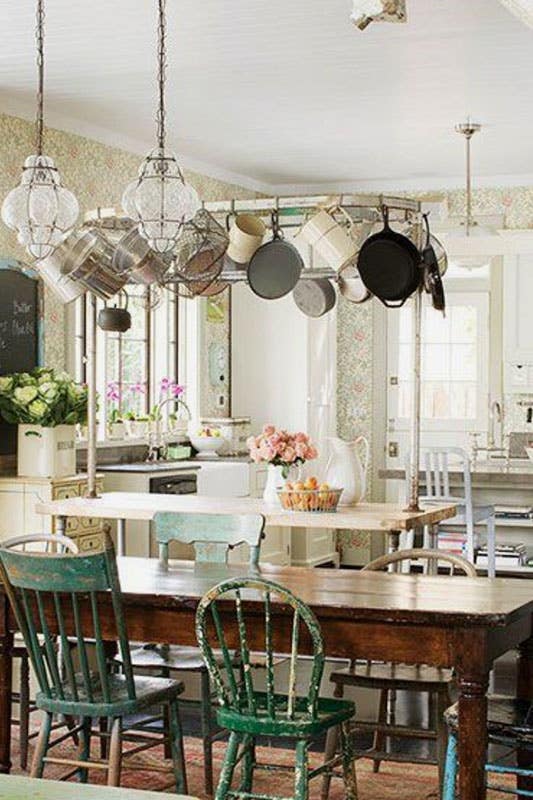 French countryside kitchen with Floral wallpaper and vintage-style range