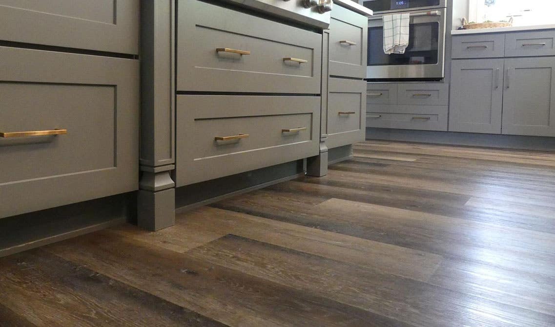 Vinyl floor tiles and gray kitchen cabinets