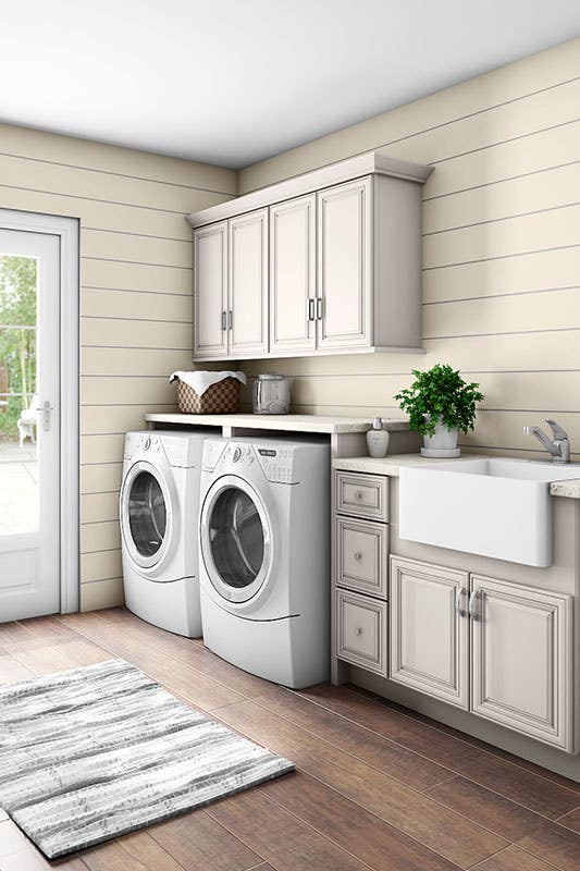 Laundry room with washer and dryer and cabinets