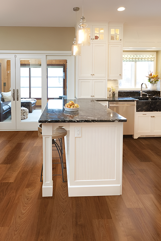 white kitchen cabinets paired with waterproof flooring 