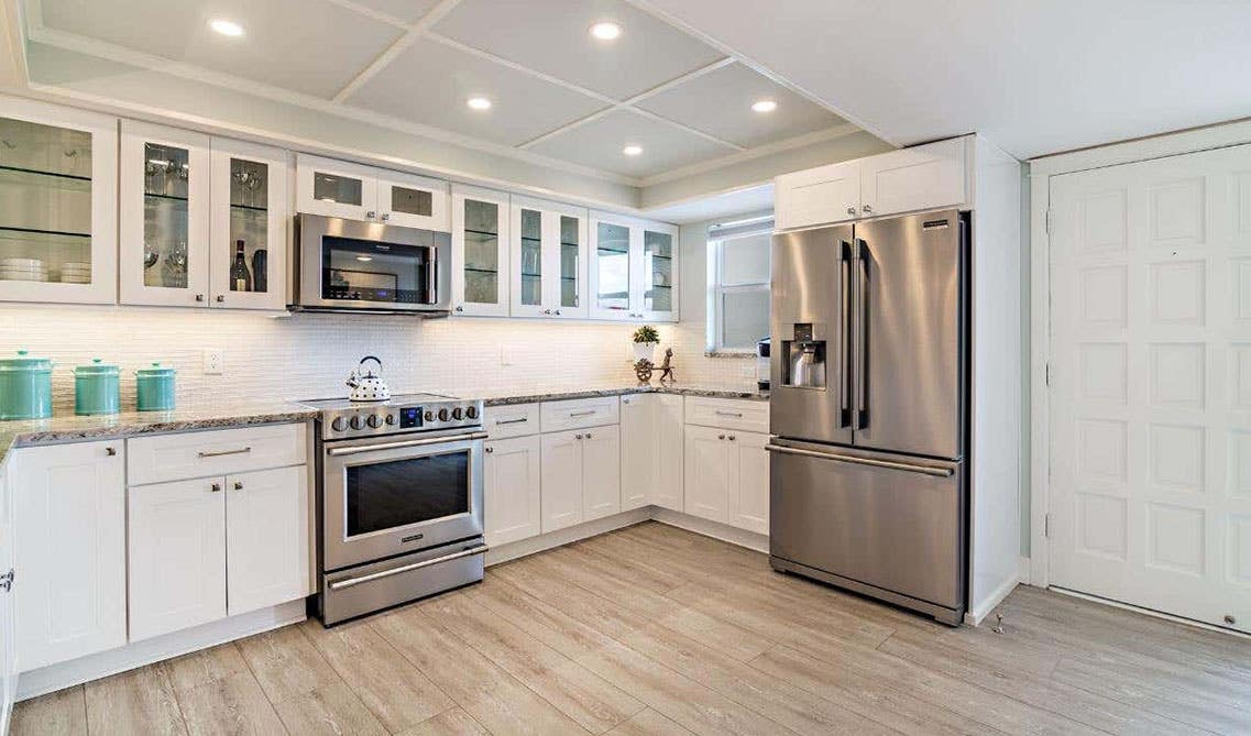 White kitchen cabinet with Geometric shapes knobs