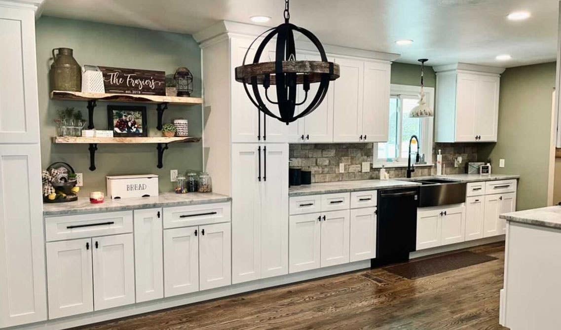 one wall white cabinet kitchen with wooden flooring and floating shelves design 