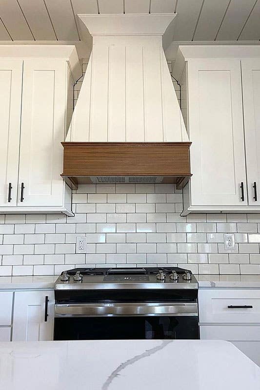 White cabinets paired with white subway tiles 