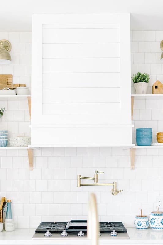 White kitchen with calming blue decor 