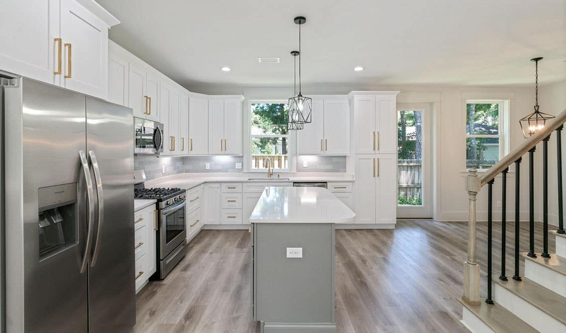 white kitchen with large island design