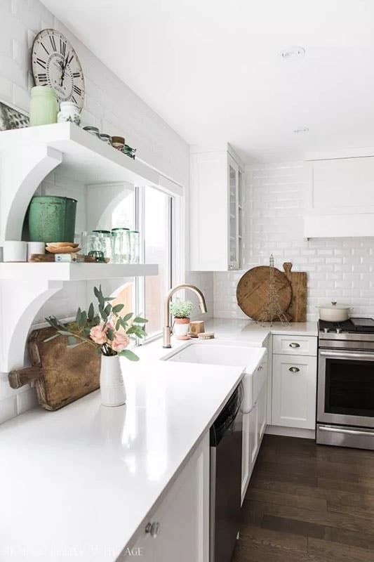 Rustic white kitchen with open shelves, Subway tiles, Shaker cabinets and marble countertop