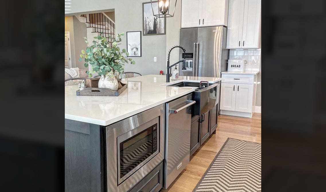 White Marble countertop with green plant