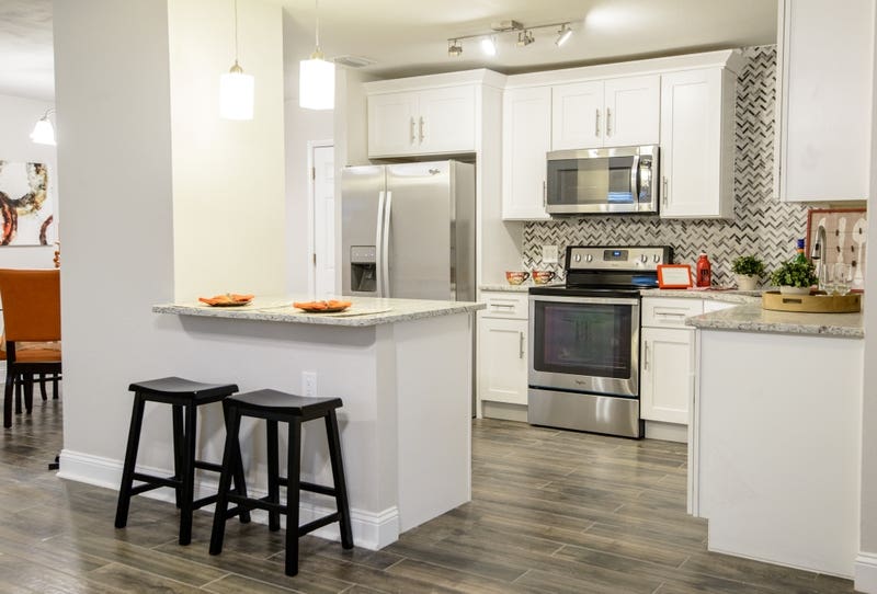 10x10 Kitchen layout with white shaker cabinets and unique countertop design