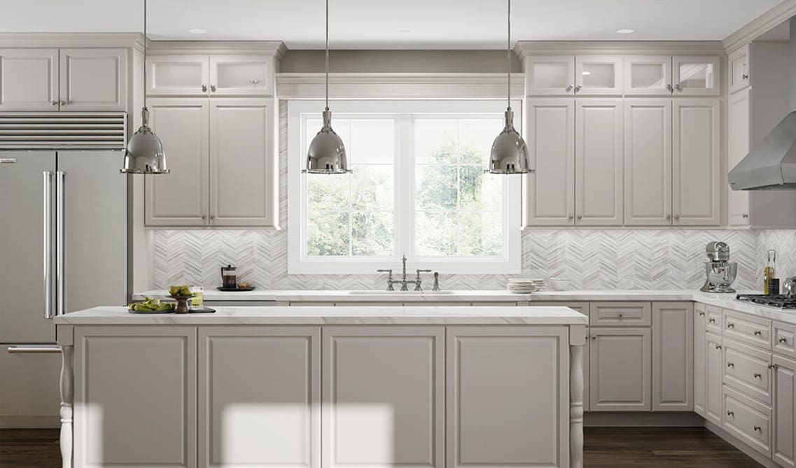 White cabinets with white backsplashes and stainless steel appliances 