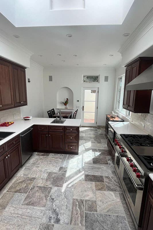 Kitchen design with White walls and brown cabinets 