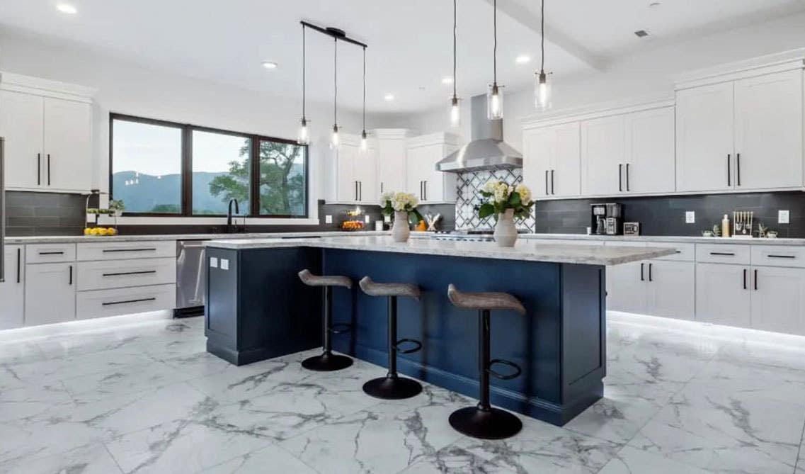 Stylish Kitchen with white and navy blue shaker cabinets
